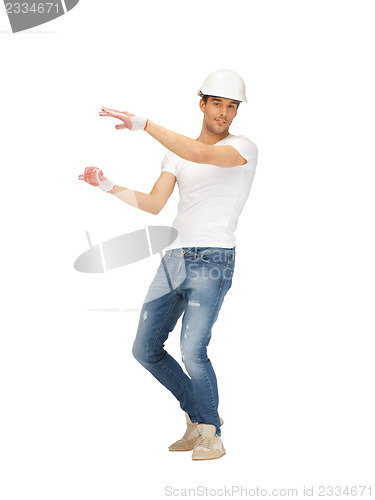 Image of handsome builder in helmet