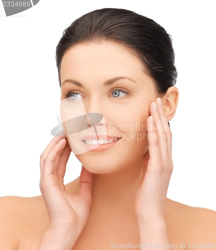 Image of face and hands of beautiful woman