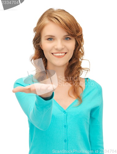 Image of girl showing something on the palm of her hand