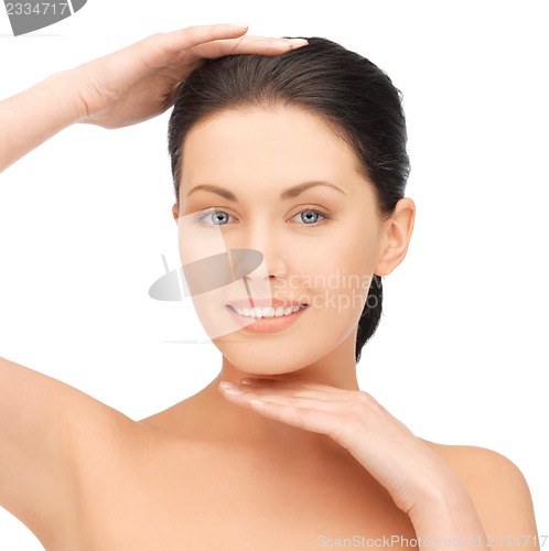 Image of face and hands of beautiful woman