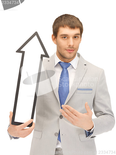 Image of businessman with direction arrow sign
