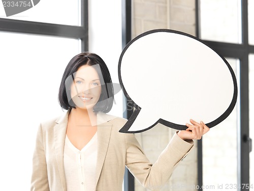 Image of smiling businesswoman with blank text bubble