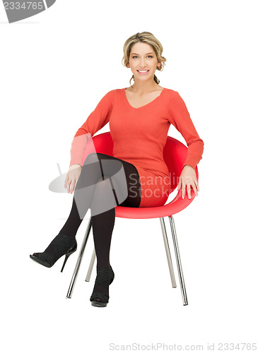 Image of young businesswoman sitting in chair