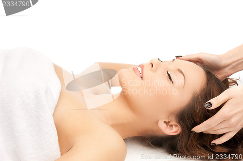 Image of beautiful woman in massage salon