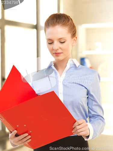 Image of calm woman with documents