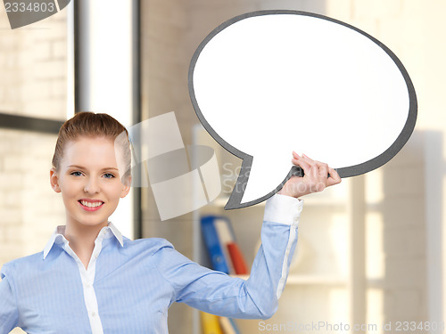 Image of smiling businesswoman with blank text bubble