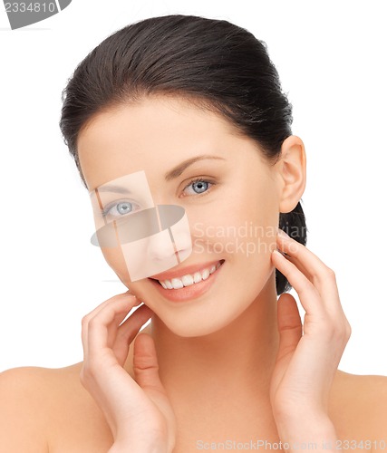 Image of face and hands of beautiful woman