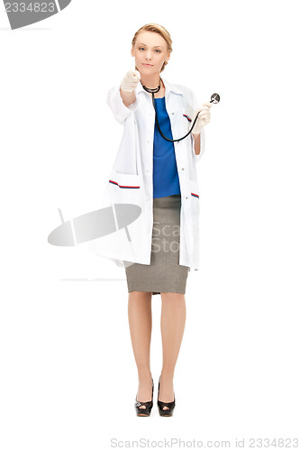 Image of attractive female doctor pointing her finger