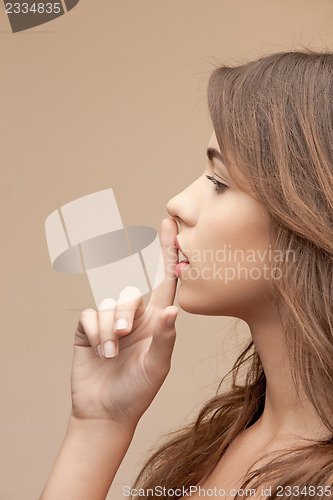 Image of finger on lips