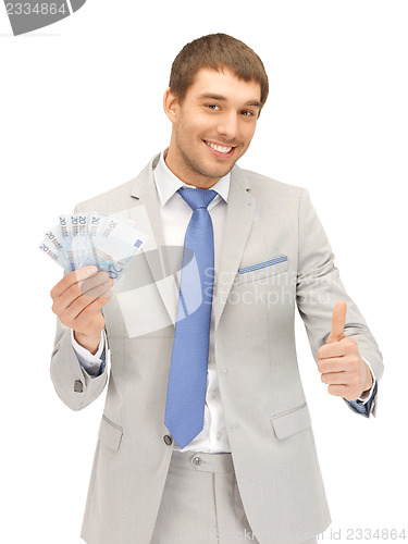 Image of handsome man with euro cash money