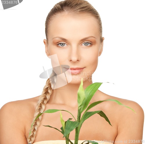 Image of woman with green sprout