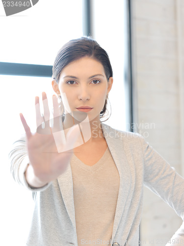 Image of woman making stop gesture