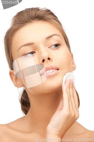Image of beautiful woman with cotton pad