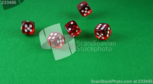 Image of An Action shot of 5 dice thrown onto the table