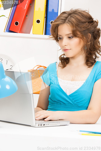 Image of happy woman with laptop computer