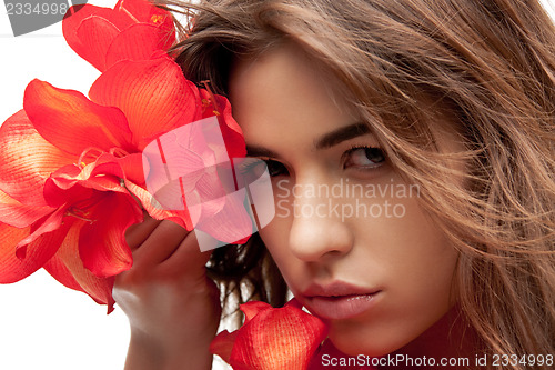 Image of lovely woman with red flowers