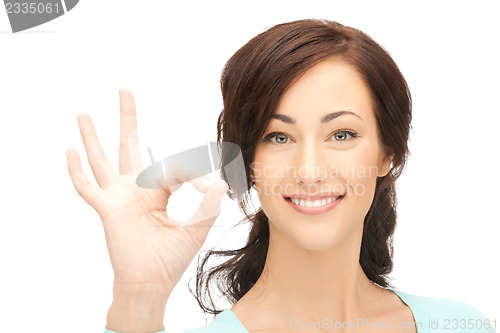 Image of young woman showing ok sign