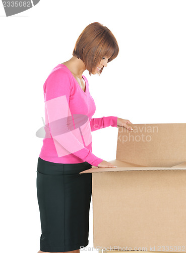 Image of attractive businesswoman with big boxes