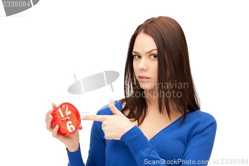 Image of woman holding alarm clock