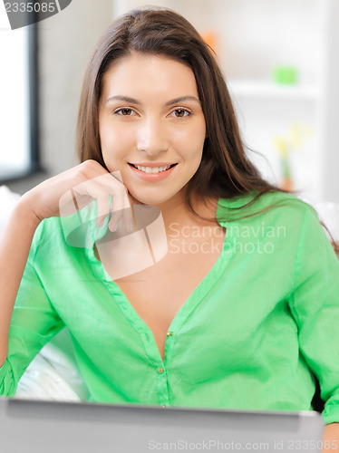 Image of happy woman with laptop computer