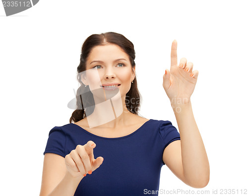 Image of businesswoman working with something imaginary