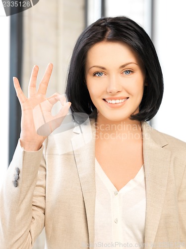 Image of young woman showing ok sign
