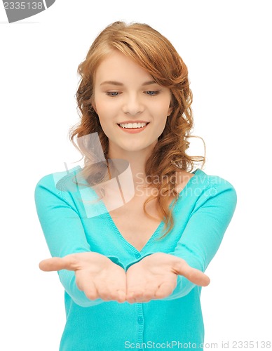 Image of girl showing something on the palms of her hands
