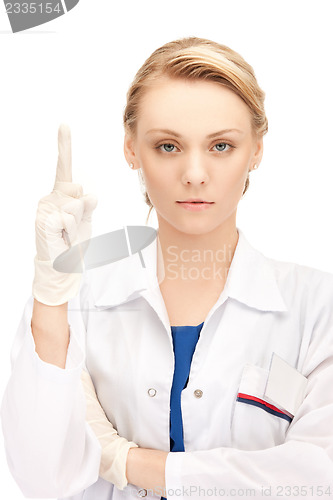 Image of female doctor with her finger up