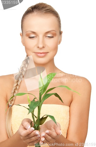 Image of woman with green sprout
