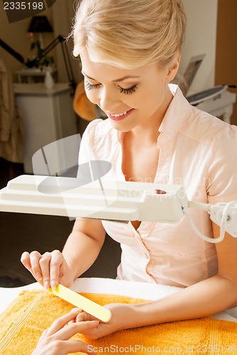 Image of woman having a manicure at the salon