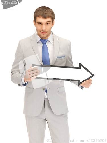 Image of businessman with direction arrow sign