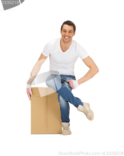 Image of handsome man with big box