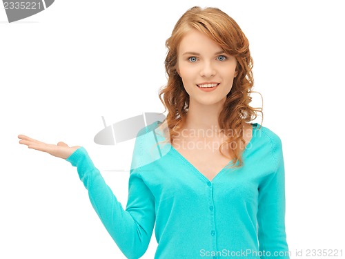 Image of girl showing something on the palm of her hand