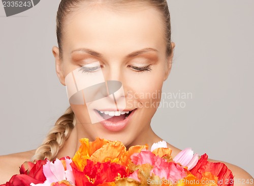 Image of lovely woman with red flowers