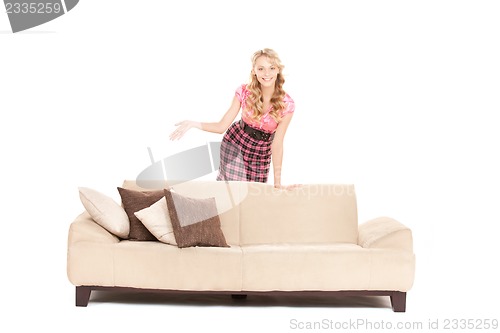 Image of happy woman on sofa