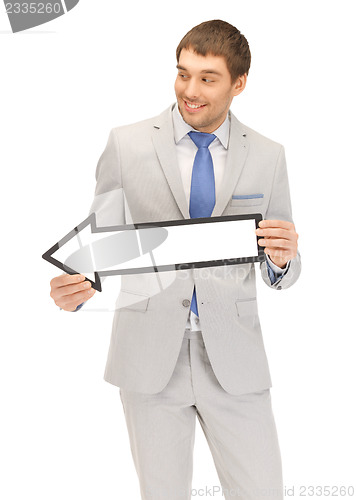 Image of businessman with direction arrow sign