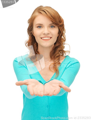 Image of girl showing something on the palms of her hands