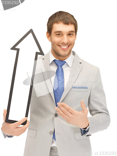 Image of businessman with direction arrow sign
