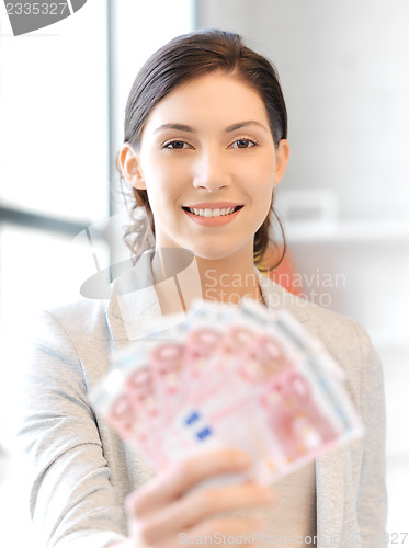 Image of lovely woman with euro cash money