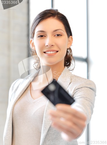 Image of happy woman with credit card