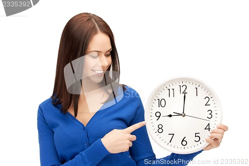 Image of woman holding big clock