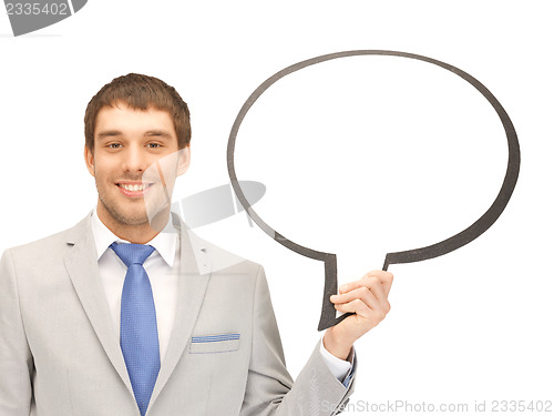 Image of smiling businessman with blank text bubble