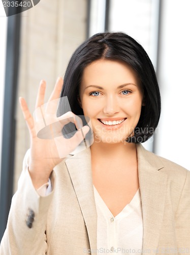 Image of young woman showing ok sign