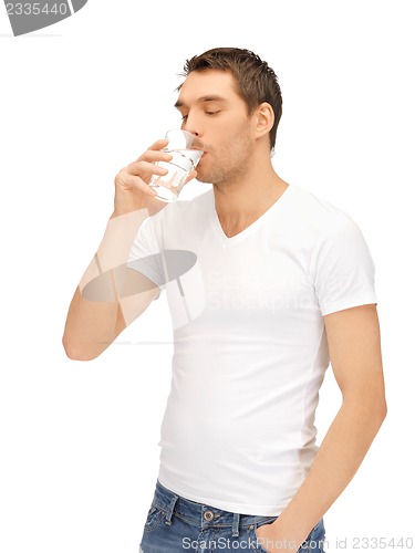 Image of man in white shirt with glass of water