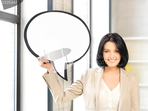 Image of smiling businesswoman with blank text bubble