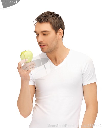 Image of man in white shirt with green apple