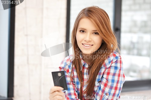 Image of happy woman with credit card