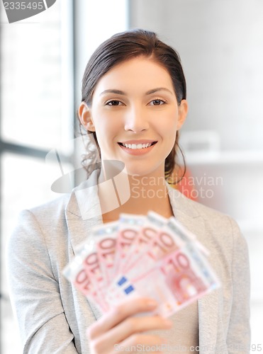 Image of lovely woman with euro cash money