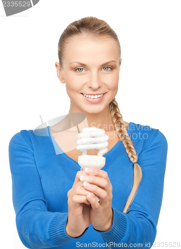 Image of woman holding energy saving bulb