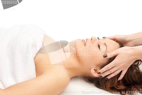 Image of beautiful woman in massage salon